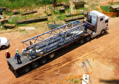 Ten metres of mast loaded onto transport after dismantling a Potain tower crane.